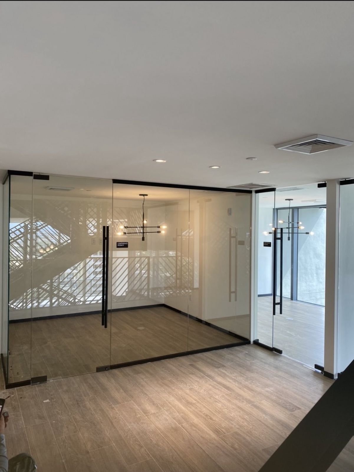 Glass conference room with black pull handles
