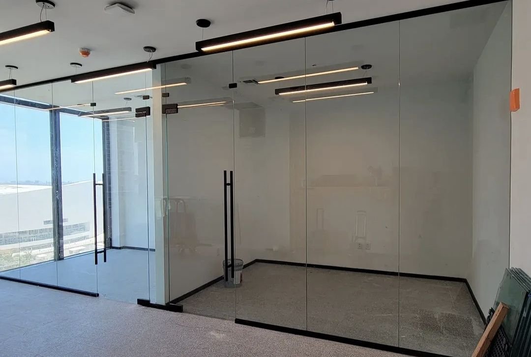 Glass office fronts with black pull handles