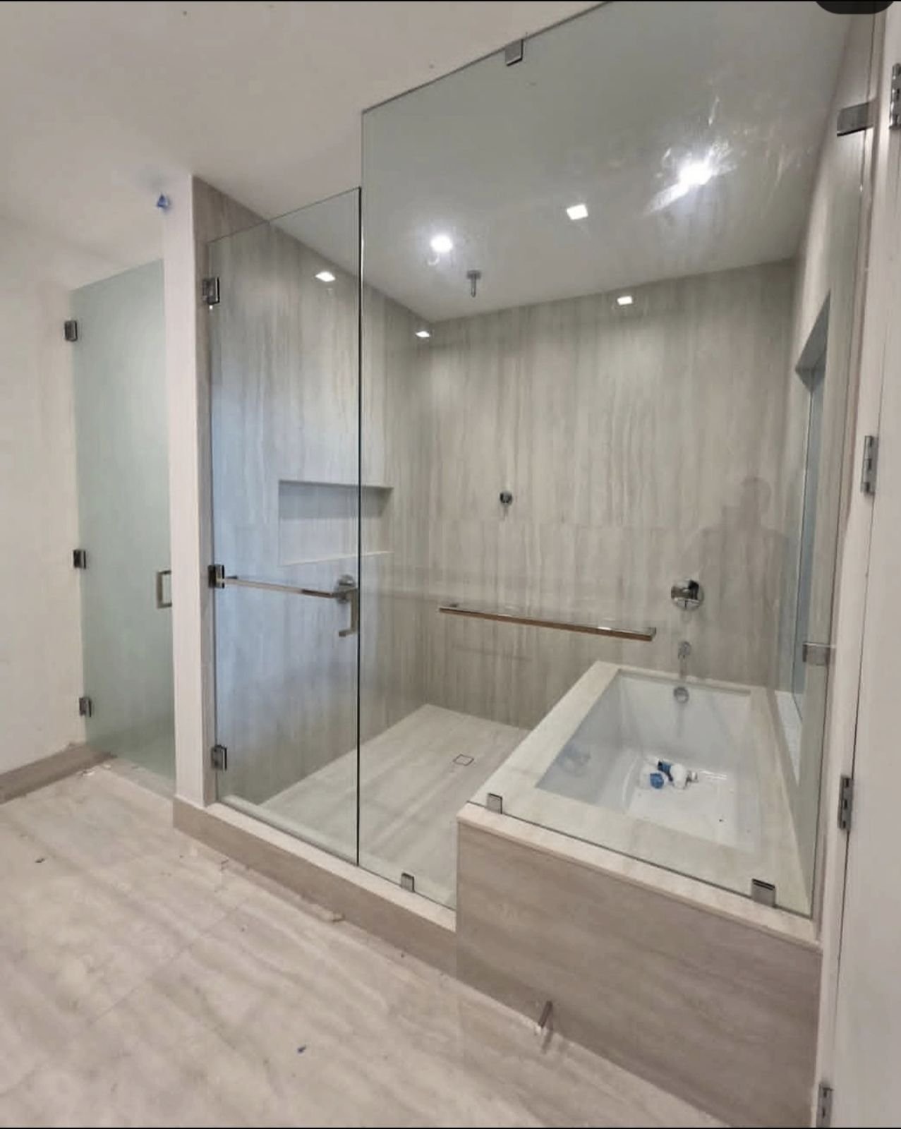 Shower and tub enclosure with frosted water closet door