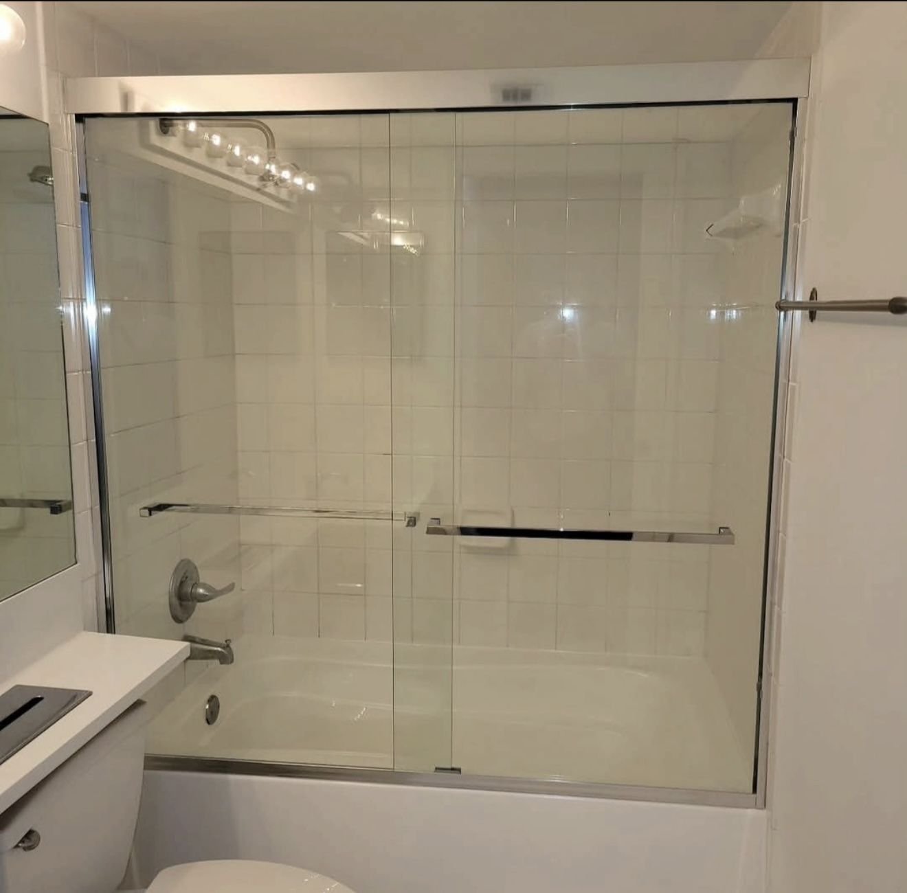 Sliding glass tub doors with chrome frame